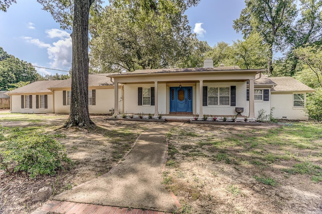 ranch-style home with a front yard