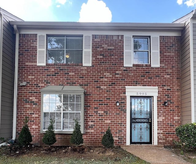 view of front of house with brick siding