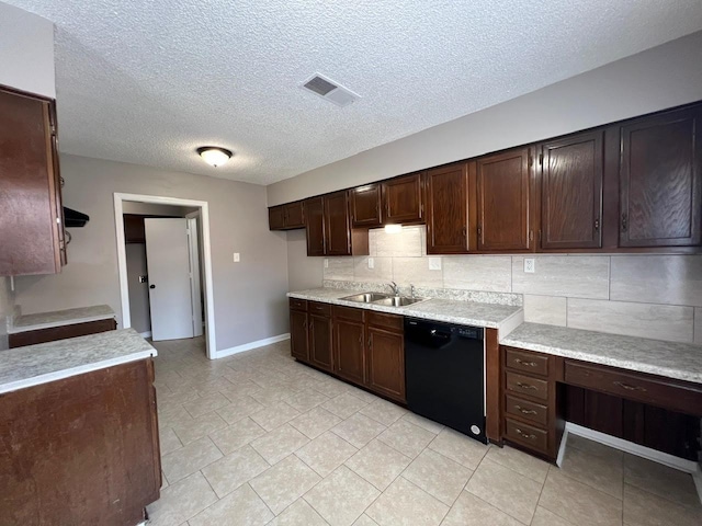 kitchen with visible vents, decorative backsplash, dishwasher, light countertops, and a sink