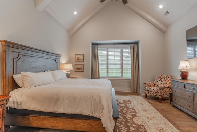 bedroom featuring high vaulted ceiling, beamed ceiling, ceiling fan, and light hardwood / wood-style flooring