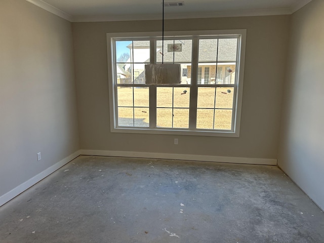 unfurnished dining area featuring crown molding, plenty of natural light, and concrete flooring