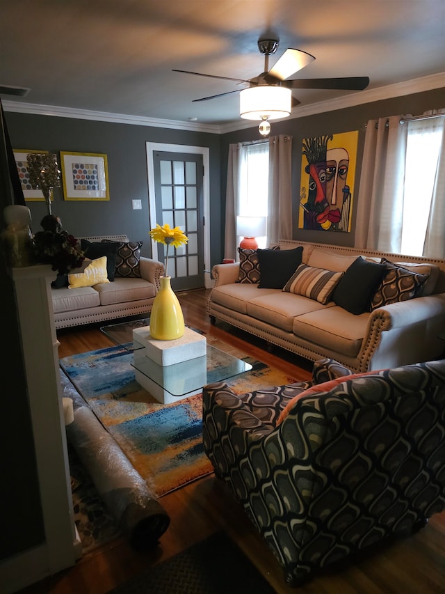 living room with ornamental molding, dark hardwood / wood-style floors, and ceiling fan