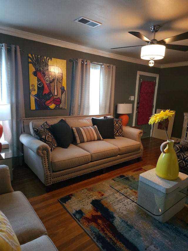 living room featuring crown molding, ceiling fan, and dark hardwood / wood-style flooring