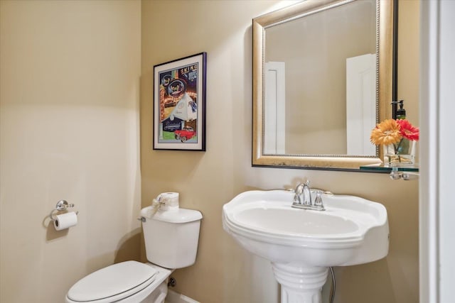 bathroom featuring sink and toilet