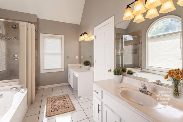 bathroom with tile patterned floors, lofted ceiling, shower with separate bathtub, and vanity