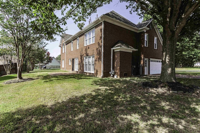 view of property exterior featuring a garage and a lawn