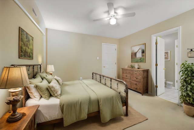 bedroom with light carpet, connected bathroom, visible vents, and a ceiling fan