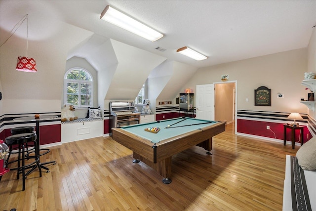 game room featuring lofted ceiling, billiards, visible vents, baseboards, and light wood-style floors