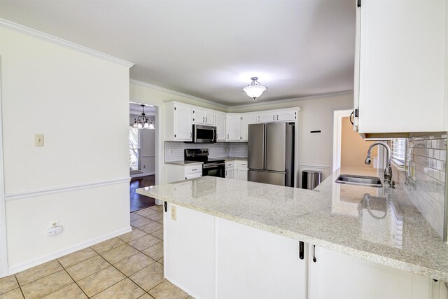 kitchen featuring appliances with stainless steel finishes, white cabinets, light tile patterned floors, kitchen peninsula, and a breakfast bar