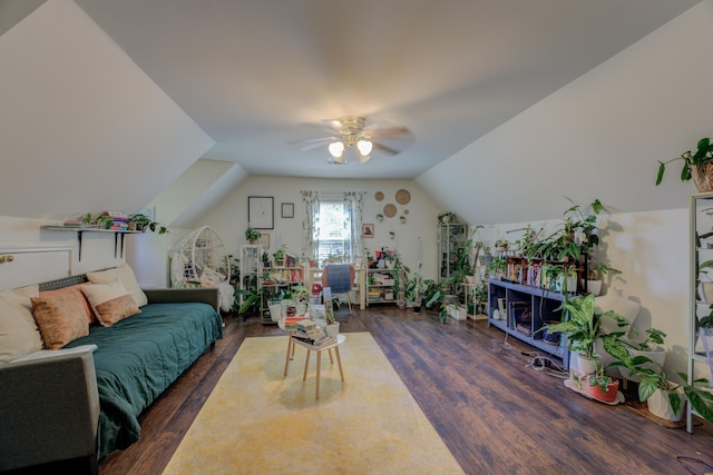 living room with ceiling fan, dark hardwood / wood-style flooring, and lofted ceiling