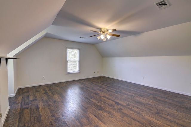 bonus room with ceiling fan, dark wood-type flooring, and lofted ceiling