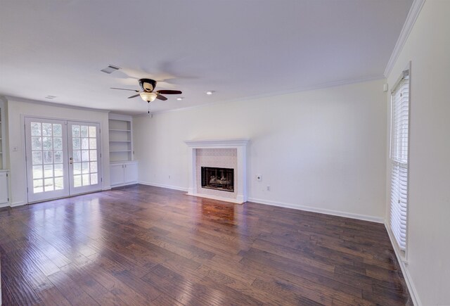 living room featuring ceiling fan, dark wood-type flooring, ornamental molding, and french doors