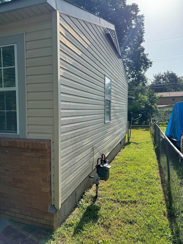 view of home's exterior with a yard