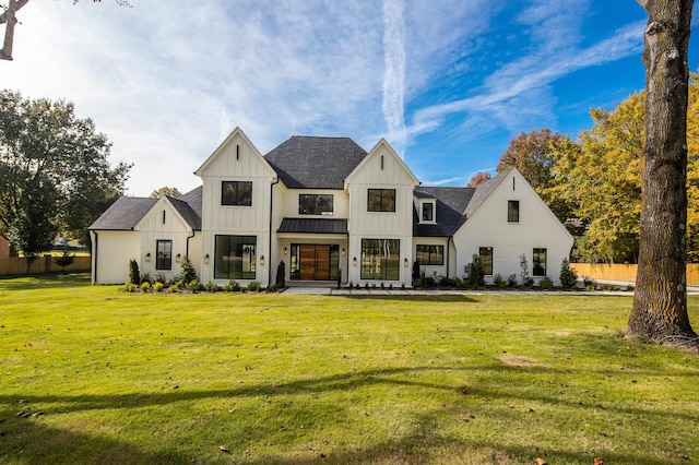 rear view of house with a lawn