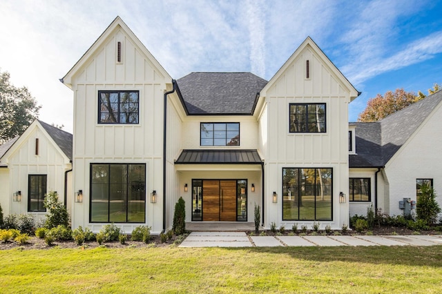 modern inspired farmhouse featuring a front lawn