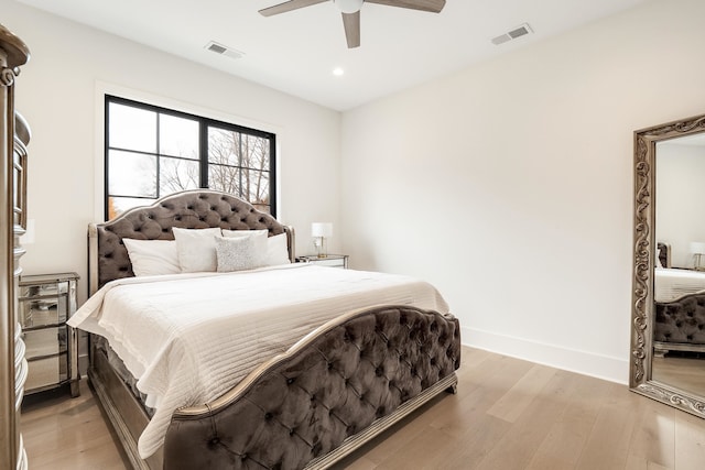 bedroom with light wood-type flooring and ceiling fan