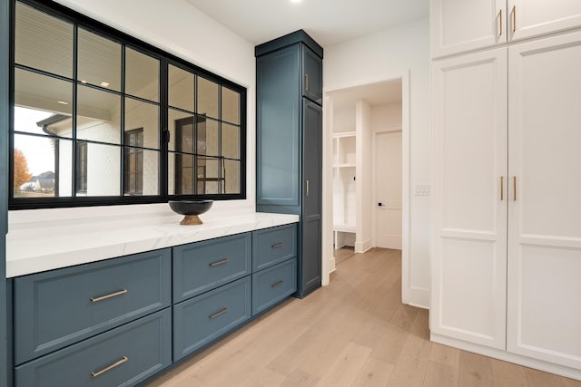 bathroom with vanity and hardwood / wood-style floors