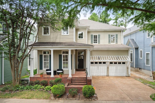 view of front facade with a garage and covered porch