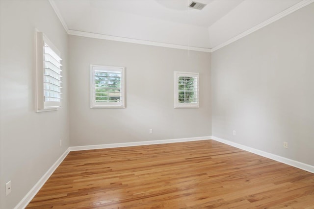 unfurnished room with ornamental molding and light hardwood / wood-style floors