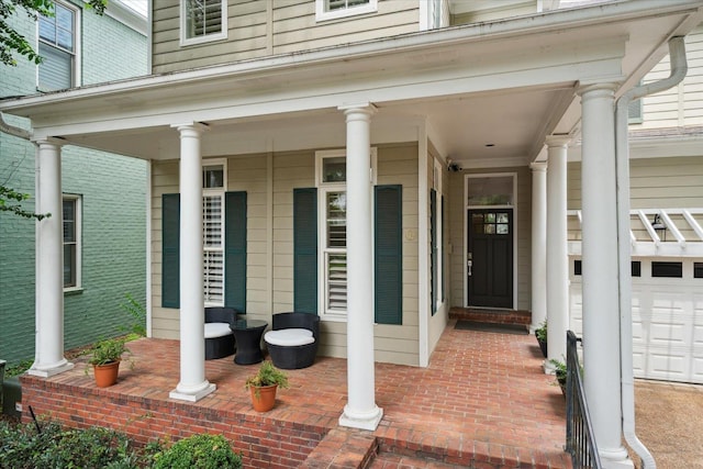 view of exterior entry featuring a garage