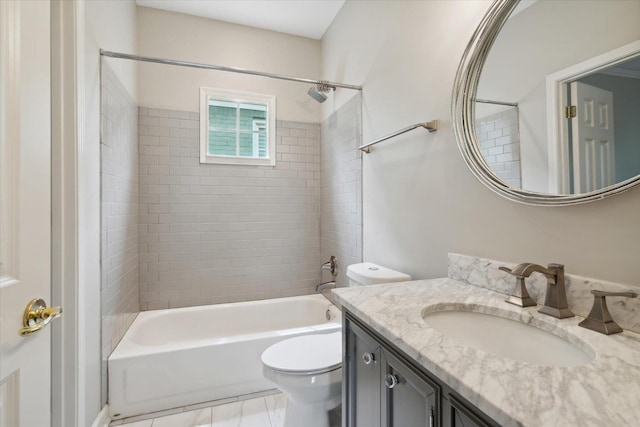 full bathroom with tiled shower / bath combo, vanity, and toilet