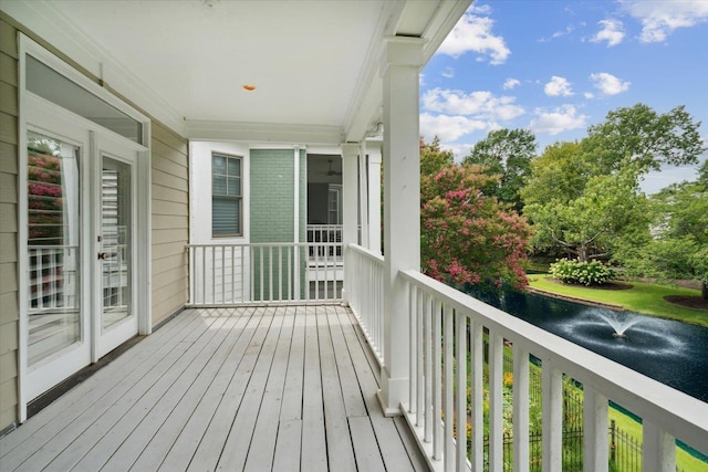 balcony featuring a water view