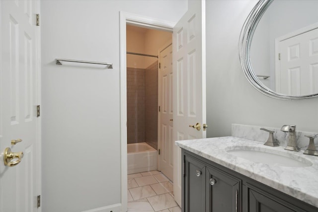 bathroom with vanity, tile patterned flooring, and tiled shower / bath combo