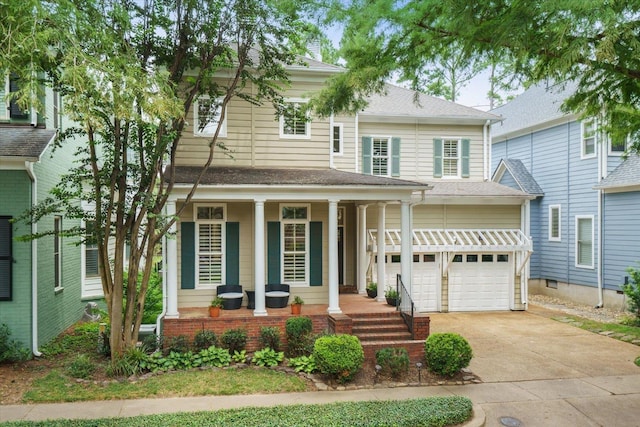 view of front of house with a garage and covered porch