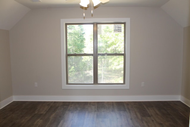 additional living space with dark hardwood / wood-style floors, ceiling fan, and vaulted ceiling