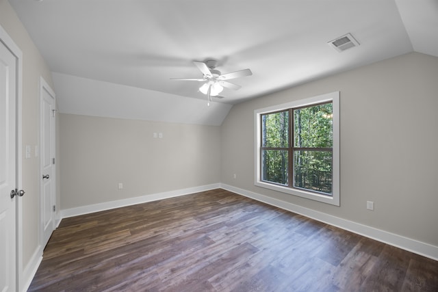 additional living space with vaulted ceiling, dark hardwood / wood-style floors, and ceiling fan