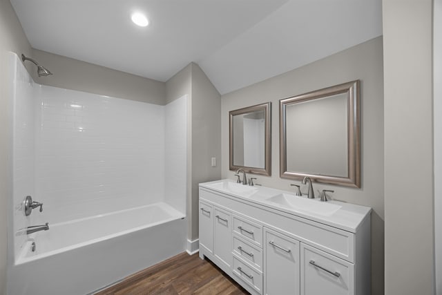 bathroom with vanity, bathtub / shower combination, and hardwood / wood-style flooring