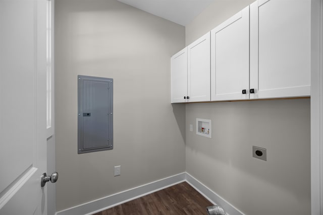 washroom with hookup for a washing machine, hookup for an electric dryer, electric panel, dark hardwood / wood-style flooring, and cabinets