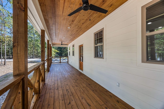 wooden deck featuring ceiling fan