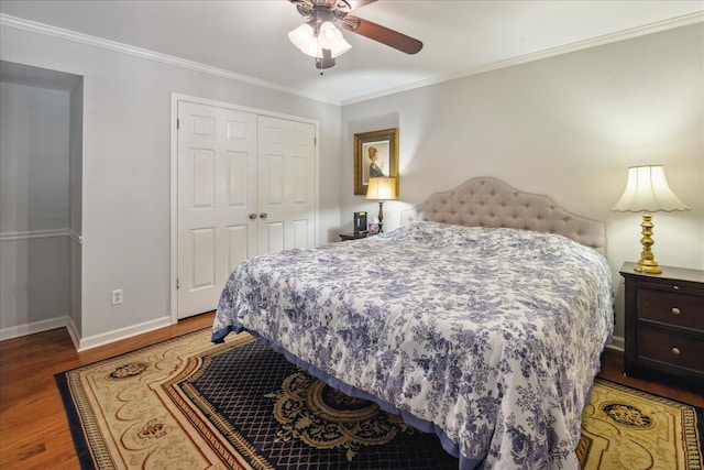 bedroom featuring ceiling fan, a closet, wood-type flooring, and ornamental molding