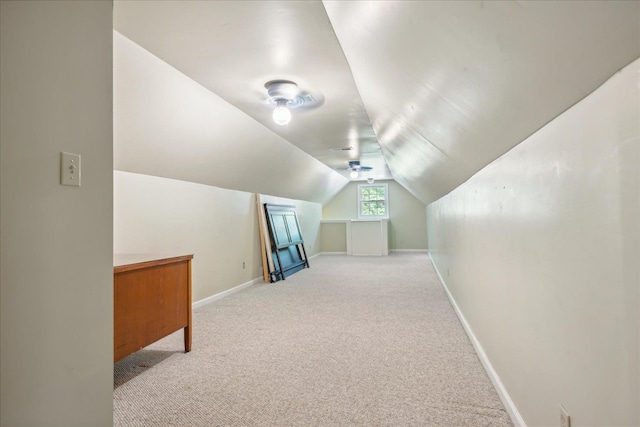 additional living space featuring carpet floors and lofted ceiling