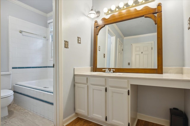 bathroom with ornamental molding, hardwood / wood-style flooring, and toilet