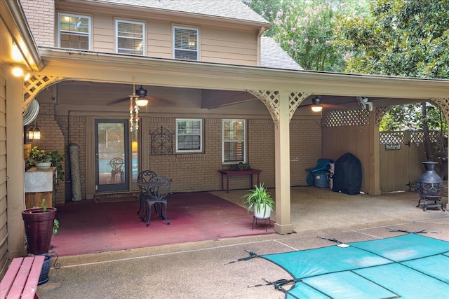 exterior space with a patio and a covered pool