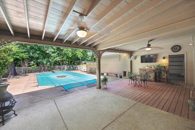 view of swimming pool featuring a patio area and ceiling fan