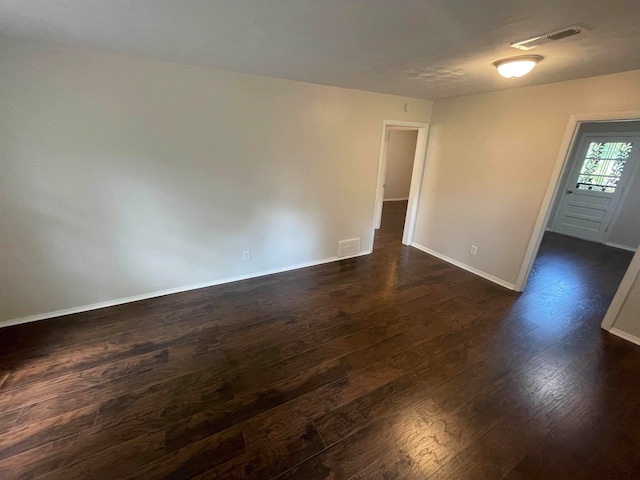 empty room featuring dark hardwood / wood-style floors