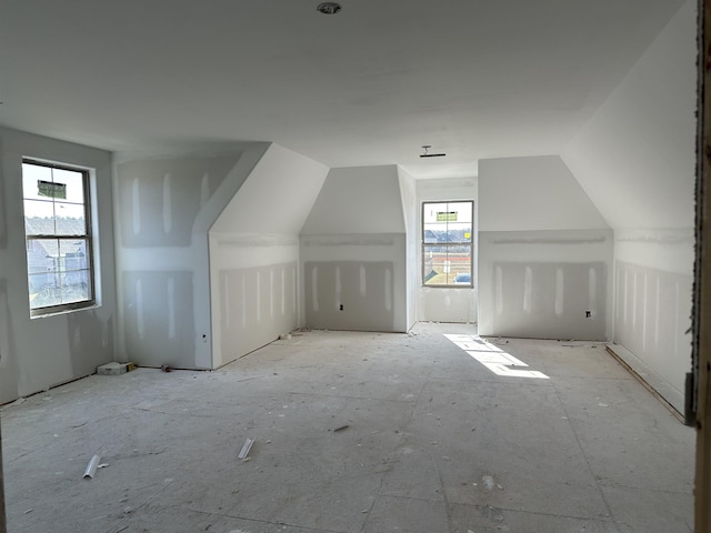 bonus room featuring vaulted ceiling