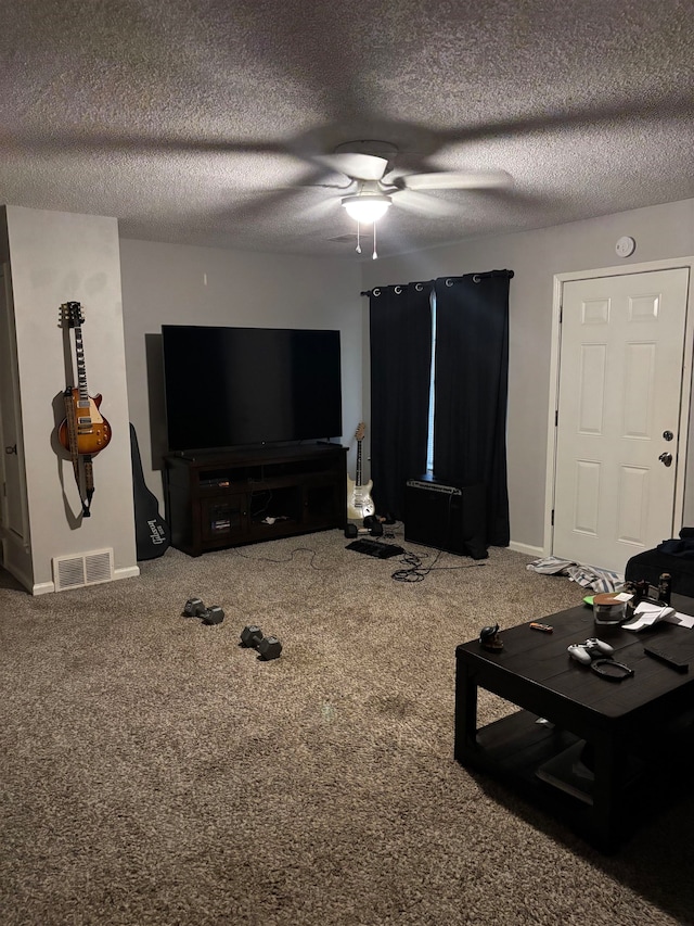 carpeted living room with ceiling fan and a textured ceiling