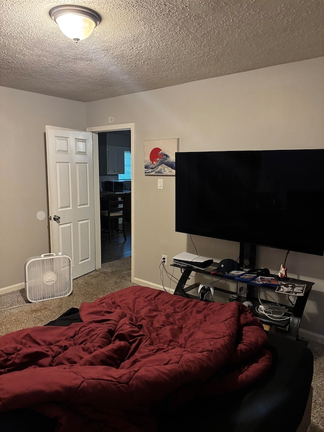 carpeted bedroom featuring a textured ceiling