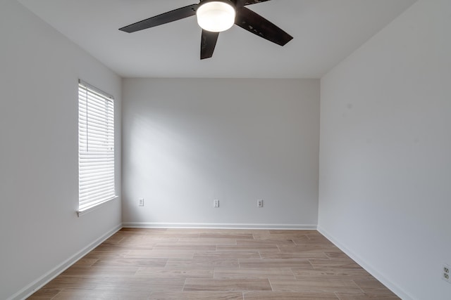 unfurnished room with light hardwood / wood-style flooring and ceiling fan