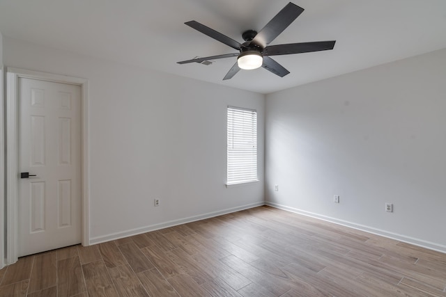 spare room featuring ceiling fan and light wood-type flooring