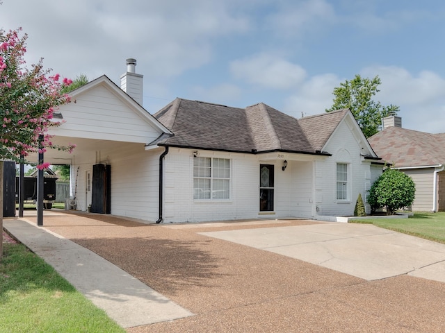 view of front of home featuring a carport