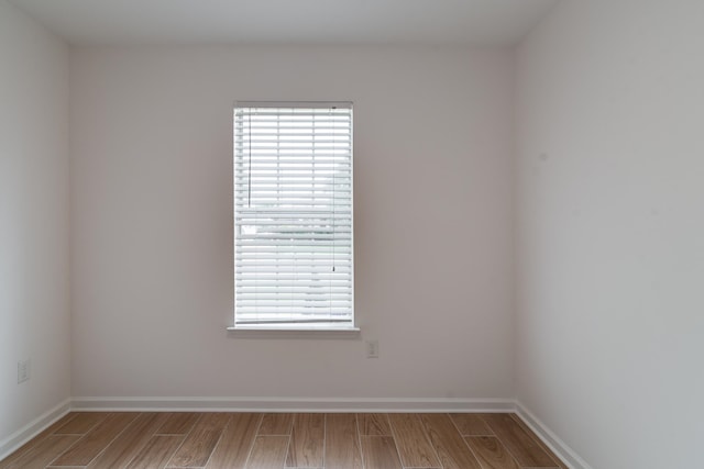 spare room featuring light hardwood / wood-style flooring