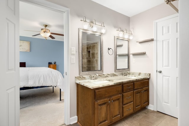 bathroom with double vanity, ceiling fan, and tile patterned floors