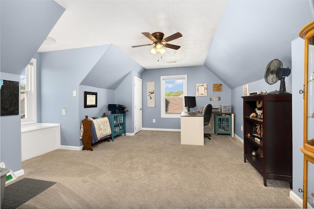 home office with light carpet, a wealth of natural light, ceiling fan, and vaulted ceiling