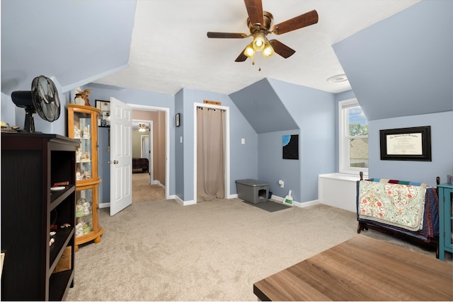 bedroom with light carpet, ceiling fan, and lofted ceiling