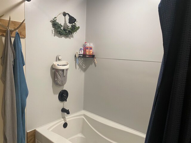 bathroom with shower / bathtub combination with curtain